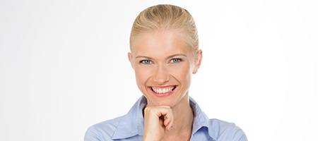 Woman with attractive smile from cosmetic dentist.