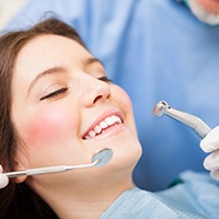 patient smiling after paying cost of cosmetic dentistry in Bellevue
